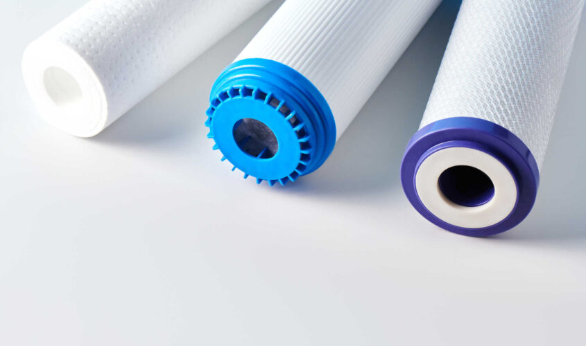 Water filters. Carbon cartridges on a white background. Household filtration system.