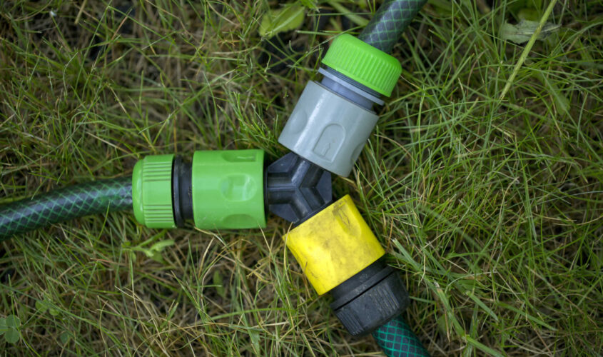 Triple connection system for watering hoses in grass