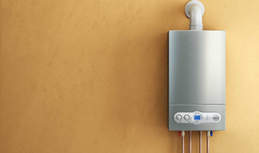 Gas-fired boiler on yellow background. Home heating.